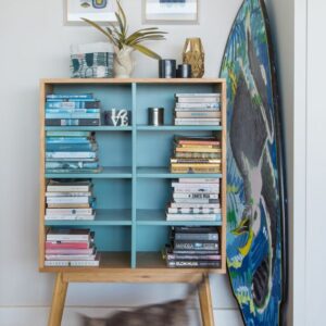 The inside of the Bird House, complete with holiday paraphenalia like surfboards and reading books.