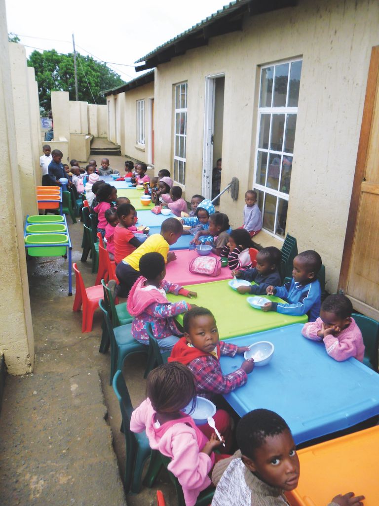 Seeds of Hope Creche children enjoying a meal.